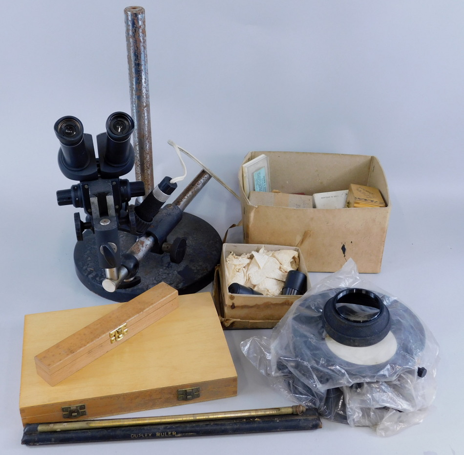 Appraisal: A laboratory type binocular microscope on adjustable stand and various