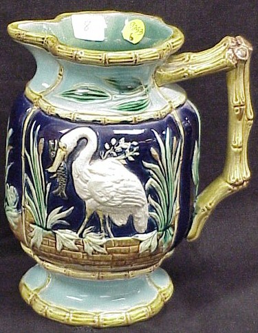 Appraisal: th C majolica pitcher h crane and reed decoration with