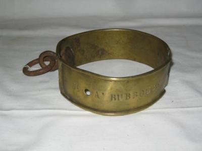 Appraisal: A VICTORIAN BRASS DOG COLLAR with moulded edges wrought iron