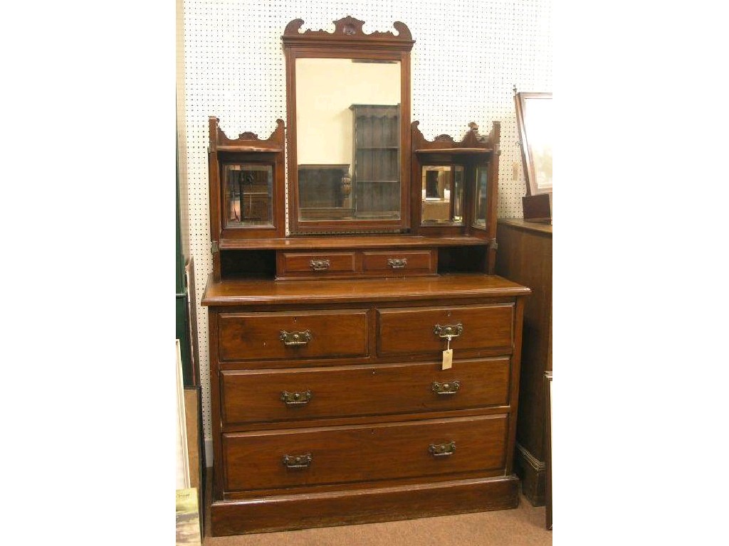 Appraisal: A late Victorian solid walnut dressing chest superstructure fitted with