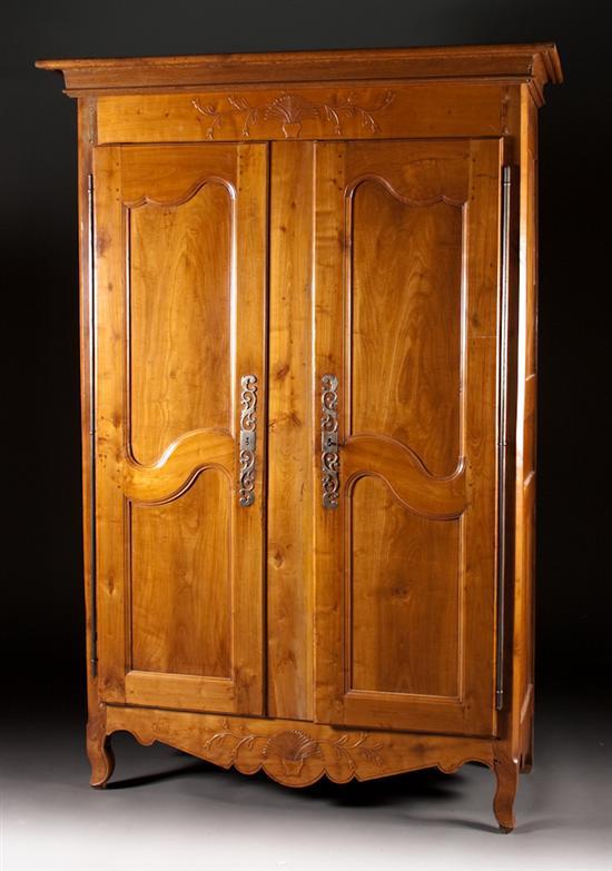 Appraisal: French fruitwood two-door armoire late th century with floral carved