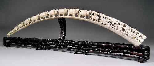 Appraisal: A large Chinese ivory tusk carved with a procession of