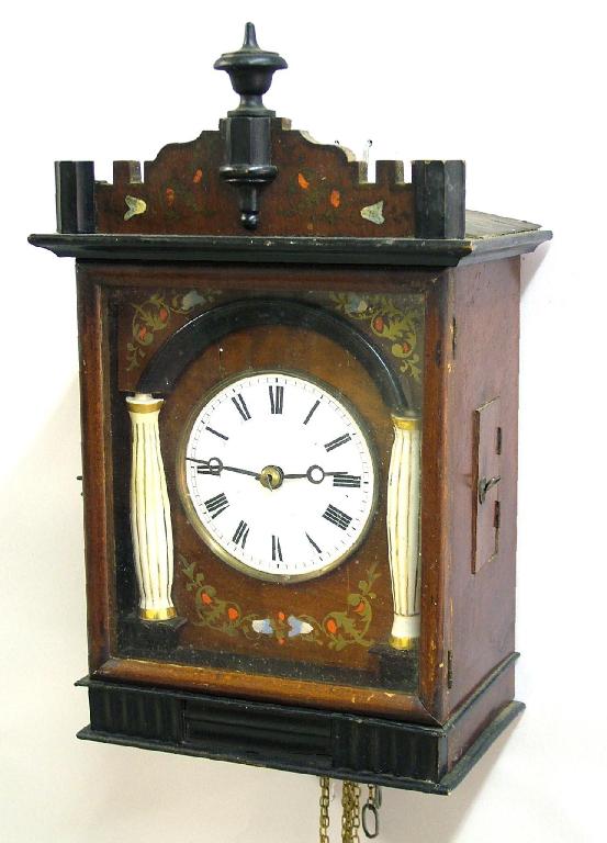 Appraisal: Black Forest two train wall clock circa the white convex