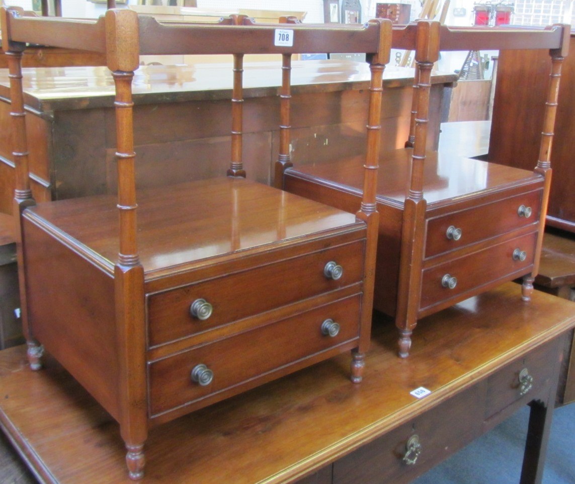 Appraisal: A pair of th century hardwood two tier bedside tables