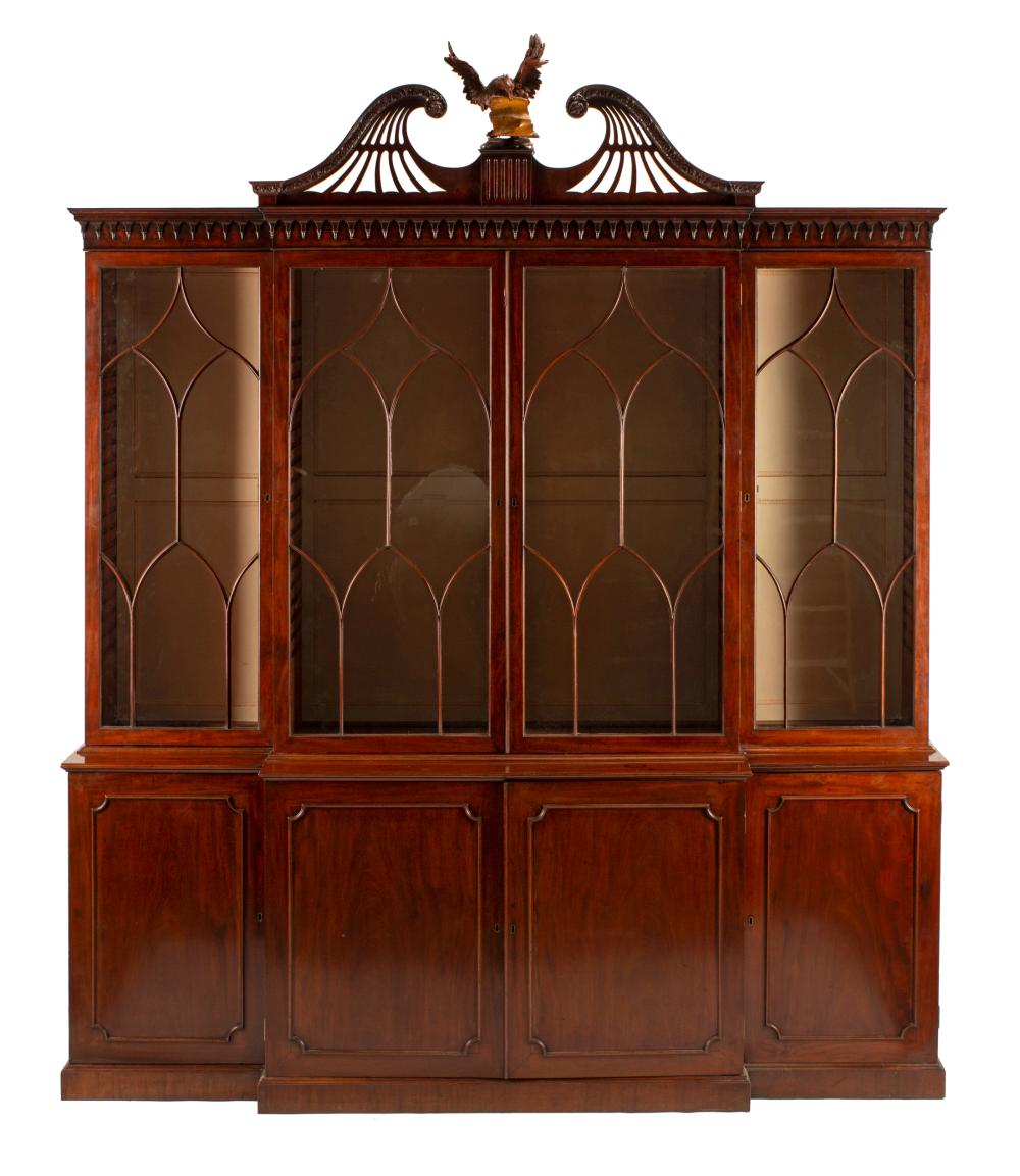 Appraisal: George III-Style Carved Mahogany Breakfront Bookcase reticulated broken arch cornice