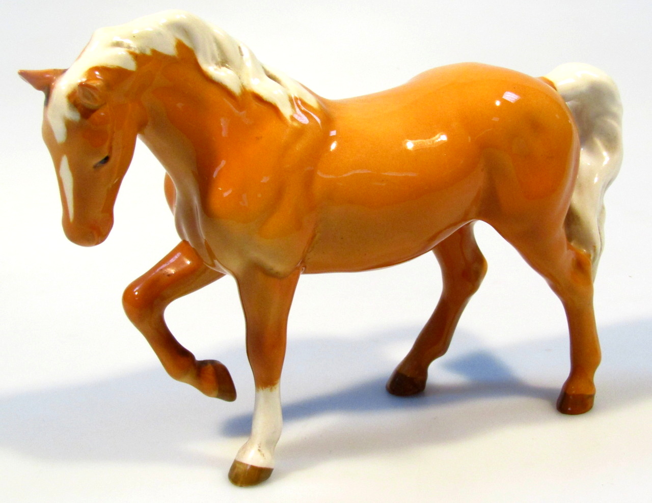 Appraisal: A Beswick figure of a palomino horse right leg raised