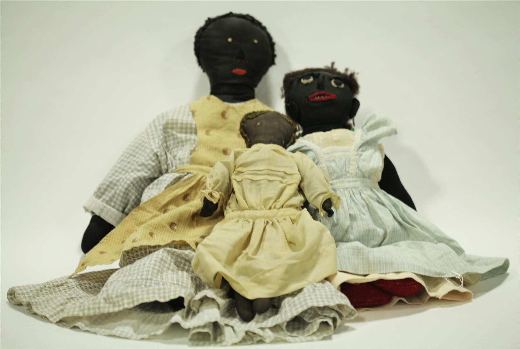 Appraisal: THREE BLACK CLOTH DOLLS Late th century The larger two