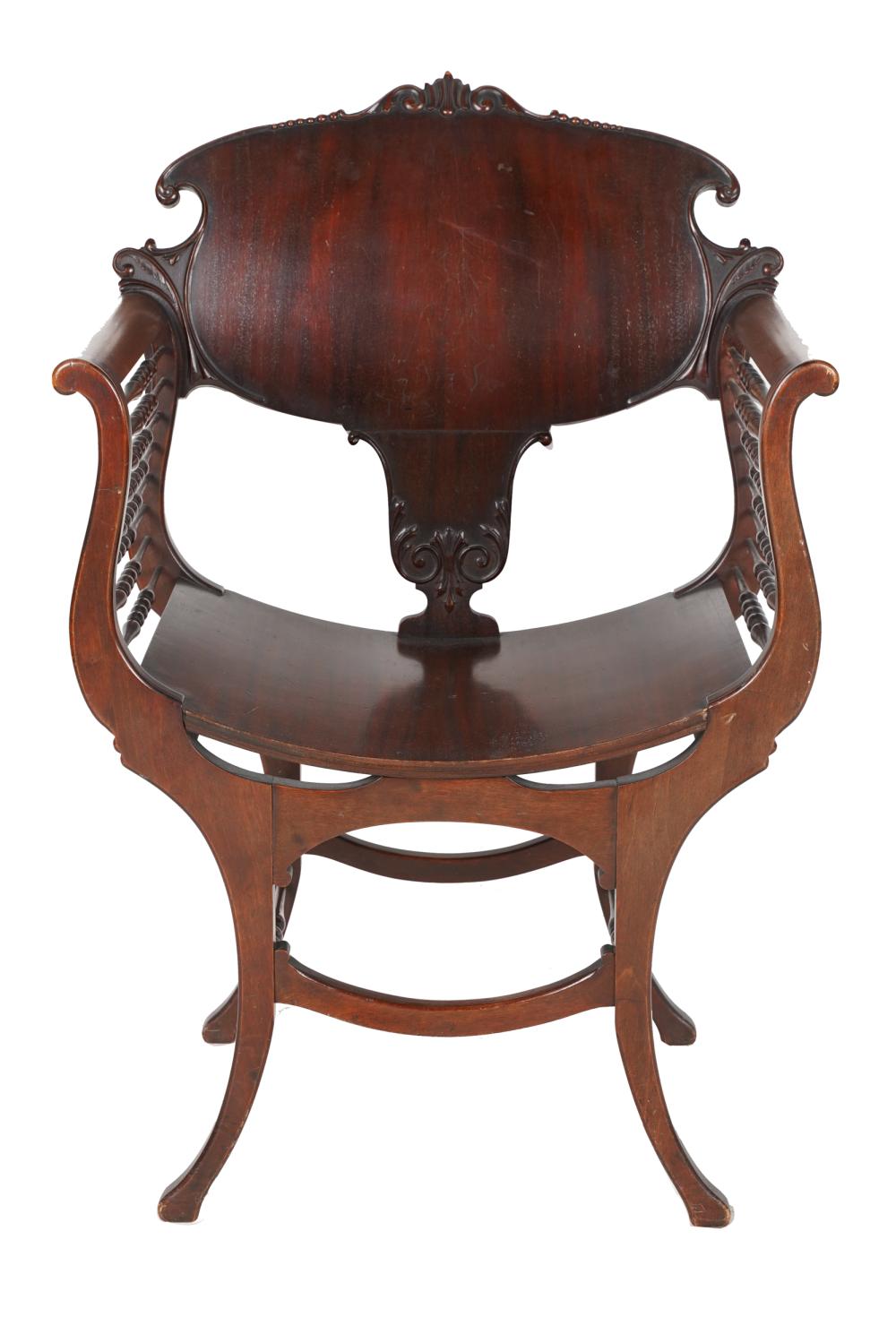 Appraisal: VICTORIAN CARVED MAHOGANY ARMCHAIRwith spindle-inset sides Condition losses to veneer