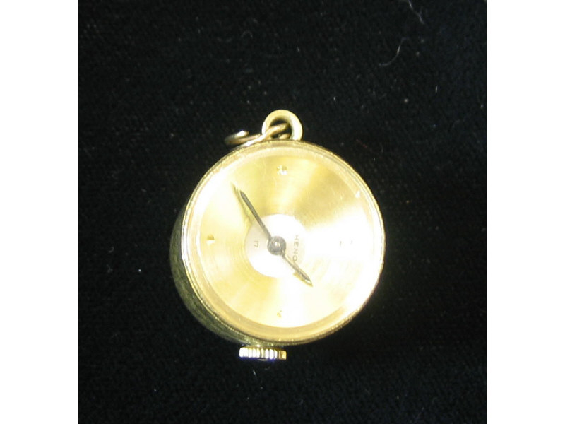 Appraisal: GOLD PENDANT WATCH Cylinder shaped watch with exhibition back and