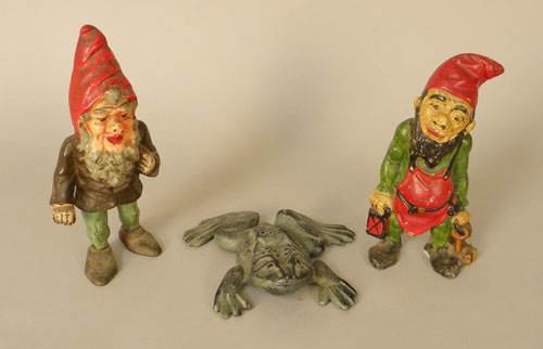 Appraisal: Two cast iron dwarf doorstops together with a frog doorstop