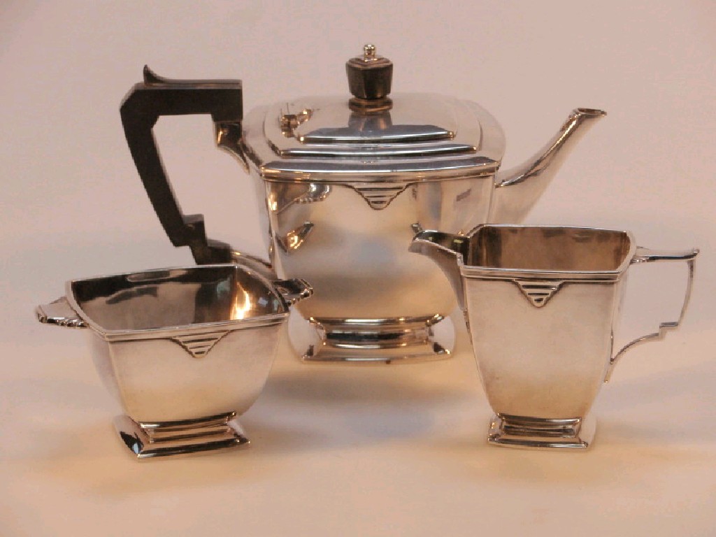 Appraisal: A Mappin Webb electroplated three piece tea services of Art