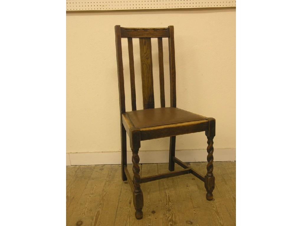 Appraisal: A set of four solid dark oak dining chairs slat-backs