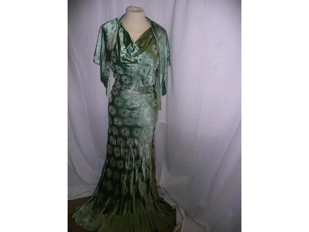 Appraisal: A green satin vintage evening dress with matching belt and