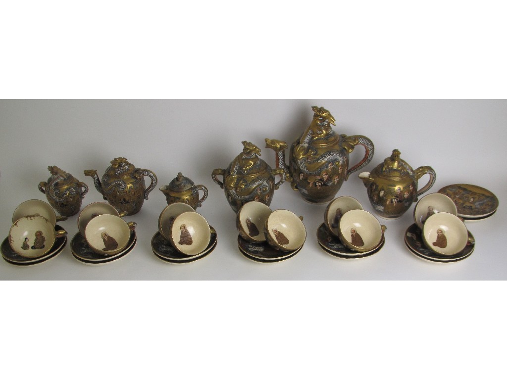 Appraisal: A Satsuma tea service decorated with immortals dragons and kannon