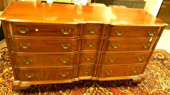 Appraisal: Chippendale form block front long bureau mahogany ogee bracket base