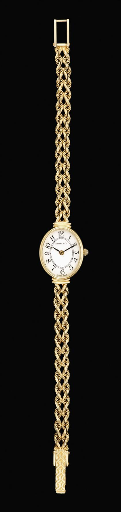 Appraisal: Lady's karat yellow gold wristwatch Tiffany Co Traditional oval white