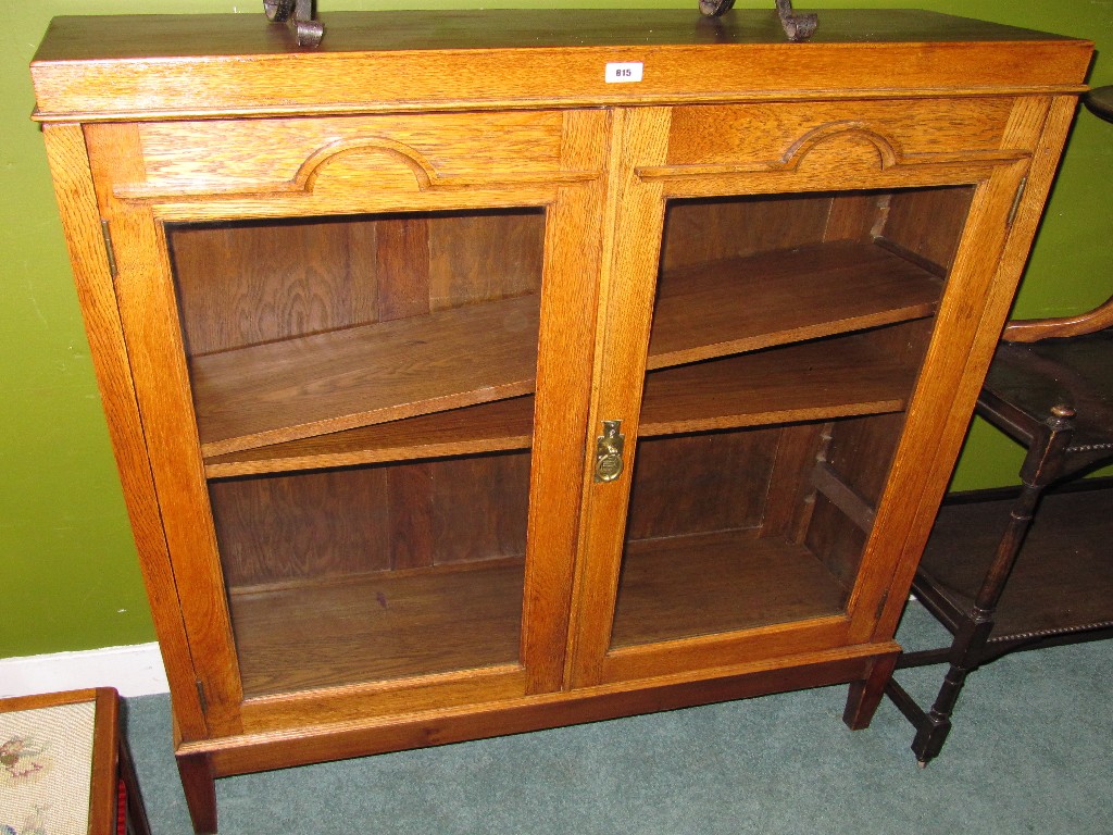 Appraisal: Oak glazed door bookcase