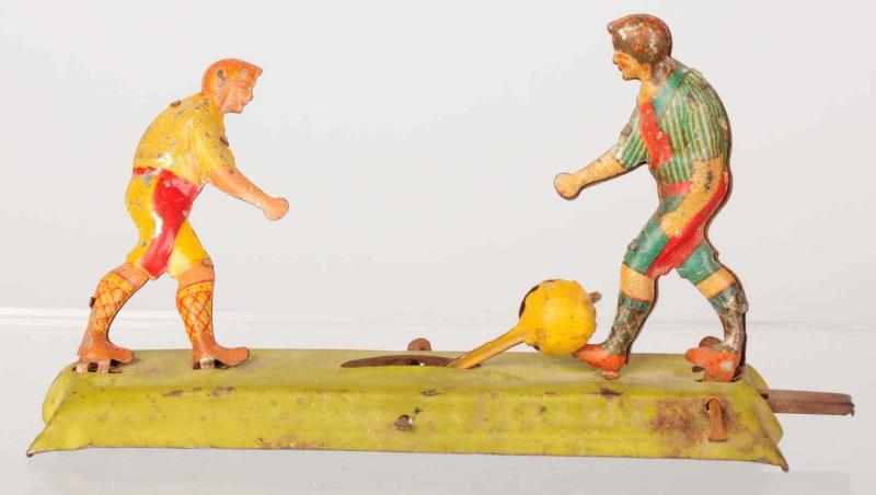 Appraisal: Scarce Tin Litho Soccer Players Penny Toy German Depicts two