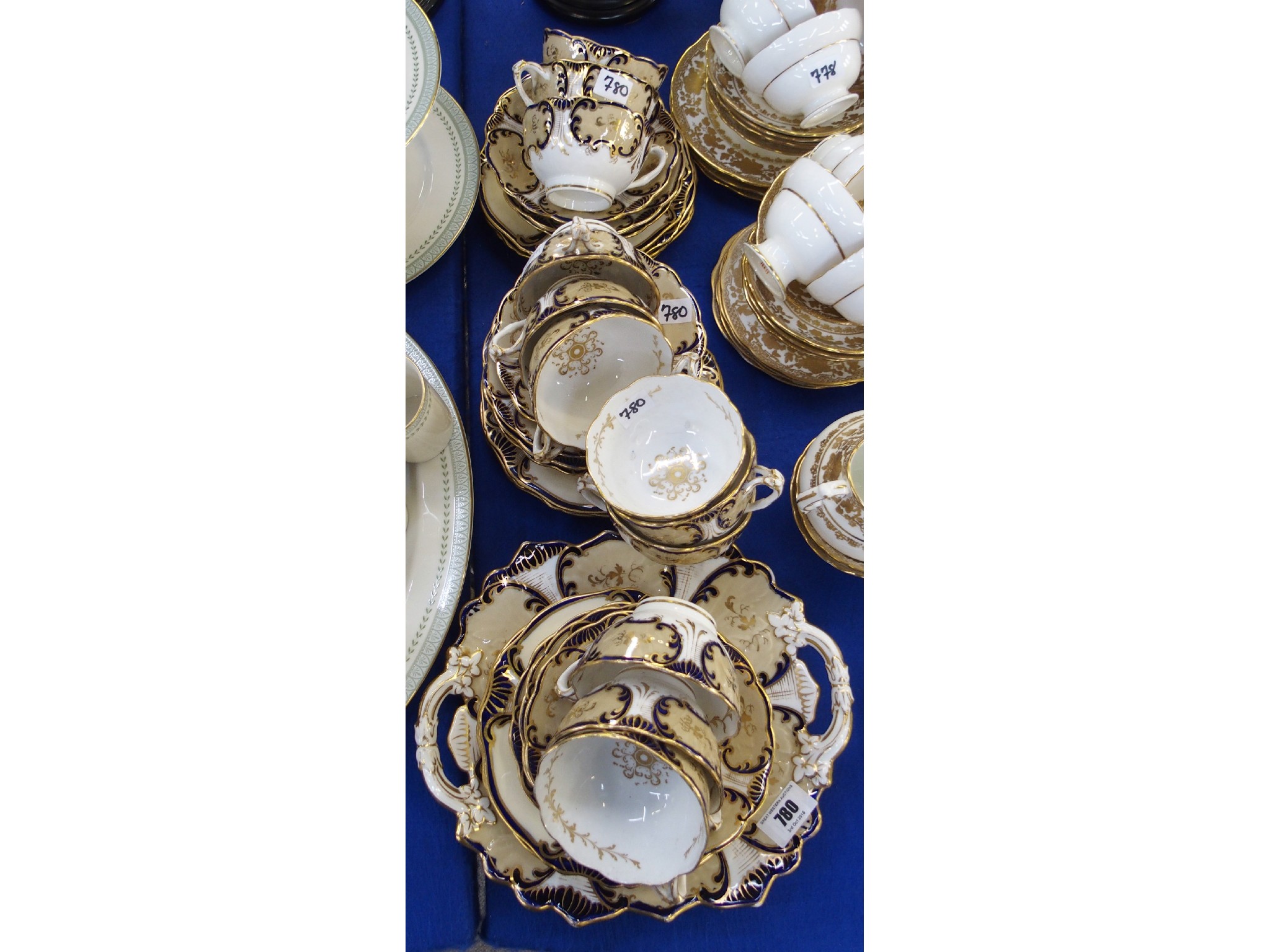 Appraisal: Continental porcelain parcel gilt and cobalt tea set for twelve