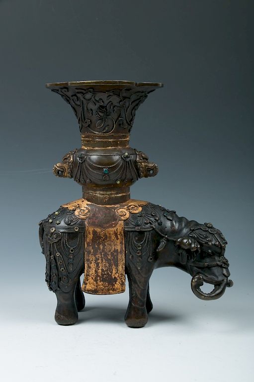 Appraisal: MINIATURE 'ELEPHANT' INCENSE HOLDERS Of four-lobe globular body the midsection