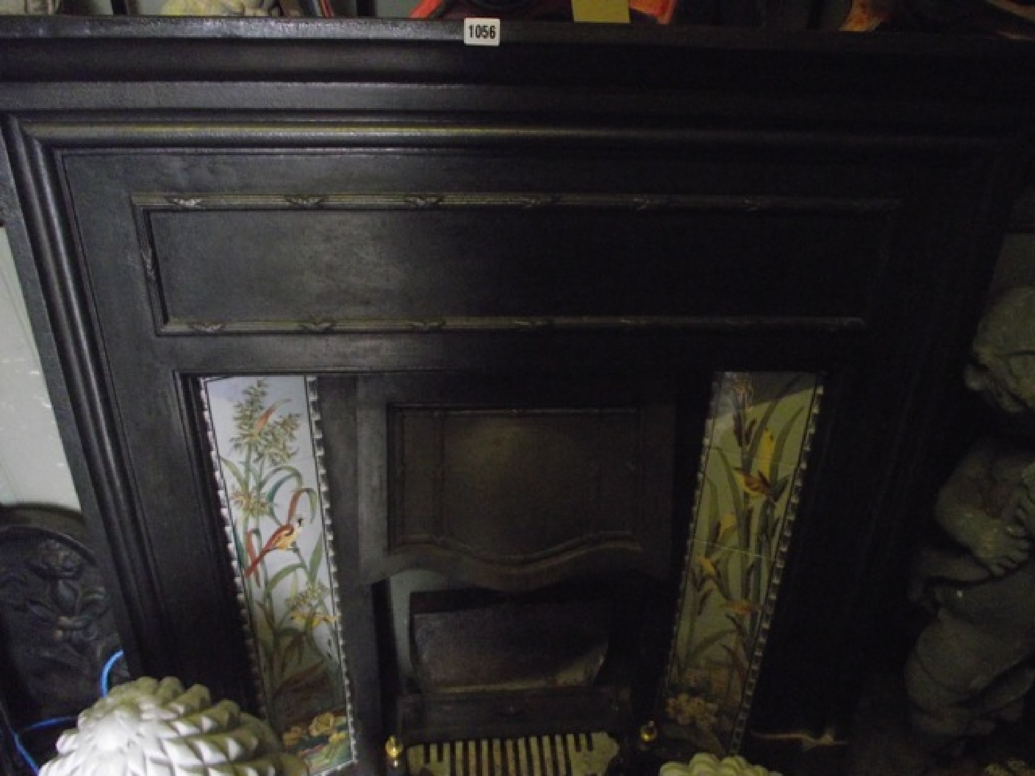 Appraisal: A late Victorian Edwardian cast iron fire insert surround incorporating