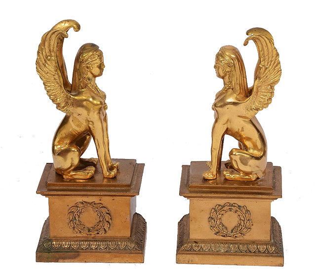 Appraisal: A PAIR OF EGYPTIAN REVIVAL GILT BRONZE SPHINXS each seated