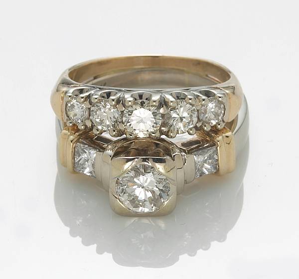 Appraisal: A diamond and k bicolor gold wedding set cetnering a