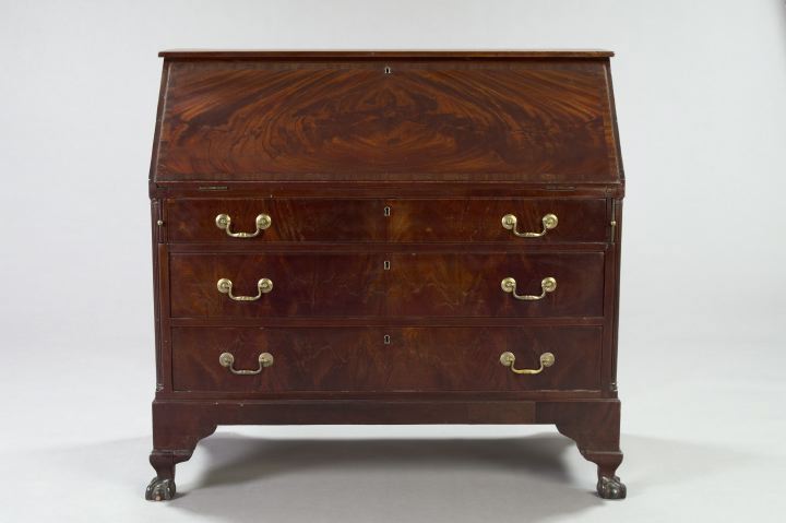 Appraisal: Regency-Inspired Mahogany Slant-Front Desk the cross-banded and figured top opening