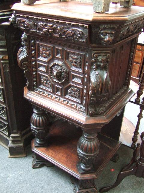 Appraisal: A th century carved oak hall cupboard the canted top