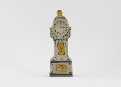 Appraisal: A Prattware model of a longcase clock decorated in the