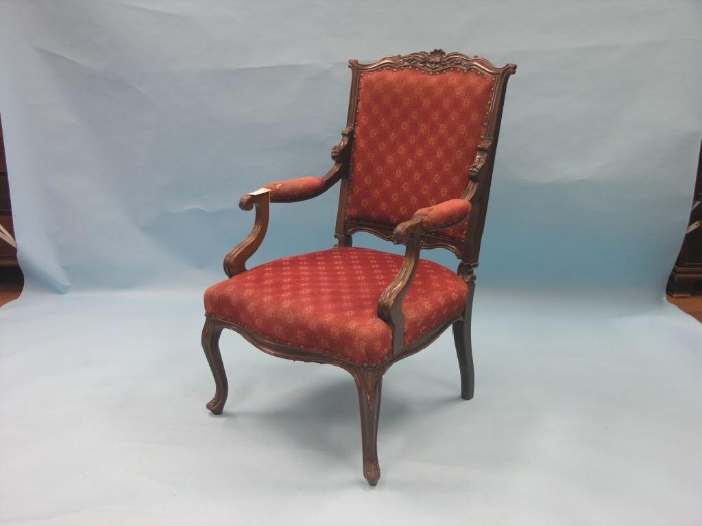 Appraisal: A late Victorian mahogany open armchair shaped top rail carved