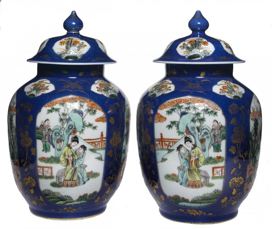 Appraisal: A PAIR OF FAMILLE VERTE JARS AND COVERS painted with