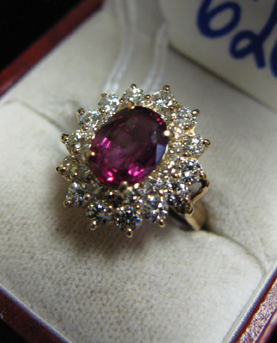 Appraisal: RUBY DIAMOND AND FOURTEEN KARAT GOLD RING set with round-cut