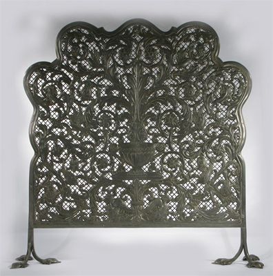 Appraisal: A pierced and cast pewter fire screen decorated with lizards