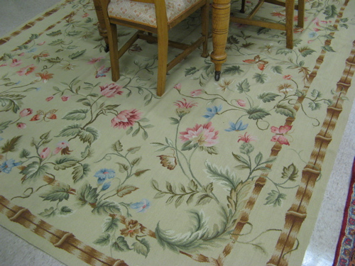 Appraisal: HAND TIED NEEDLEPOINT CARPET overall French floral decoration on tea