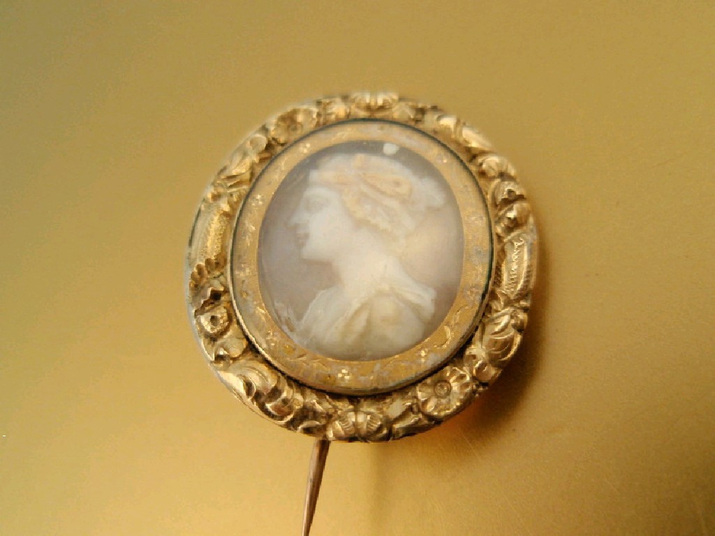 Appraisal: An early Victorian brooch with carved female head cameo under