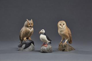 Appraisal: Two Miniature Owls and a Puffin Eddie Wozny b Two