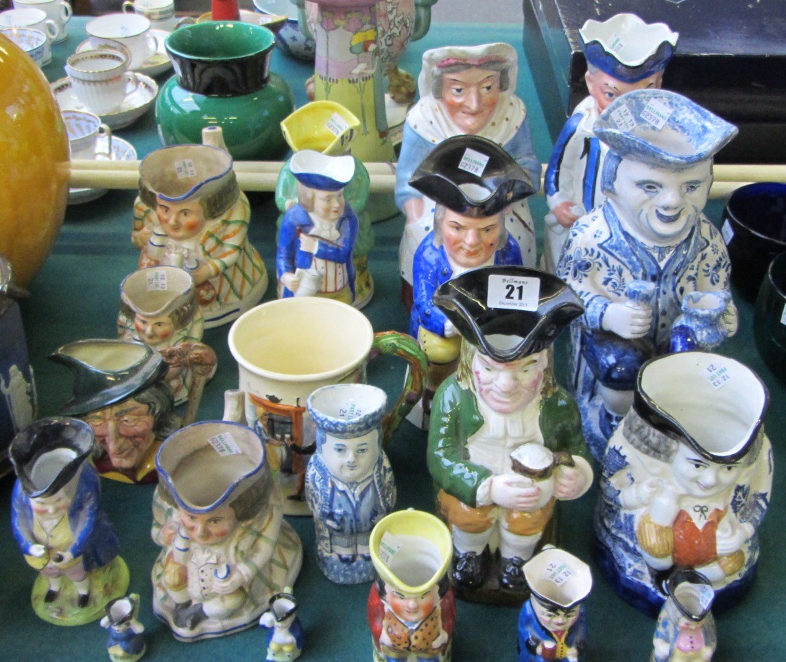 Appraisal: A group of eighteen various pottery and porcelain Toby jugs