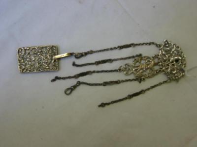 Appraisal: A CHATELAINE BELT CLIP of oval form pierced with foliate