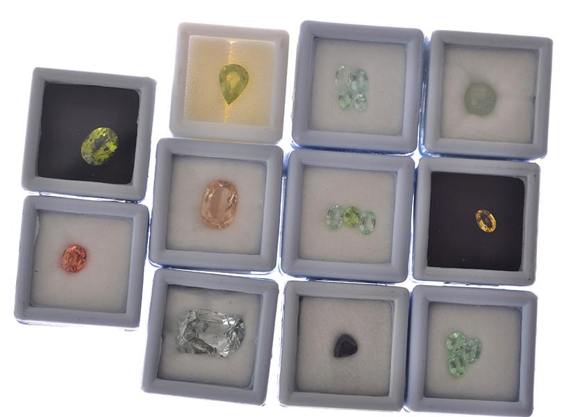 Appraisal: A COLLECTION OF LOOSE GEMSTONES INCLUDING ORANGE SAPPHIRE TOURMALINE PERIDOT