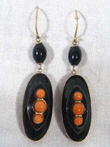 Appraisal: A pair of carat gold onyx and coral drop earrings