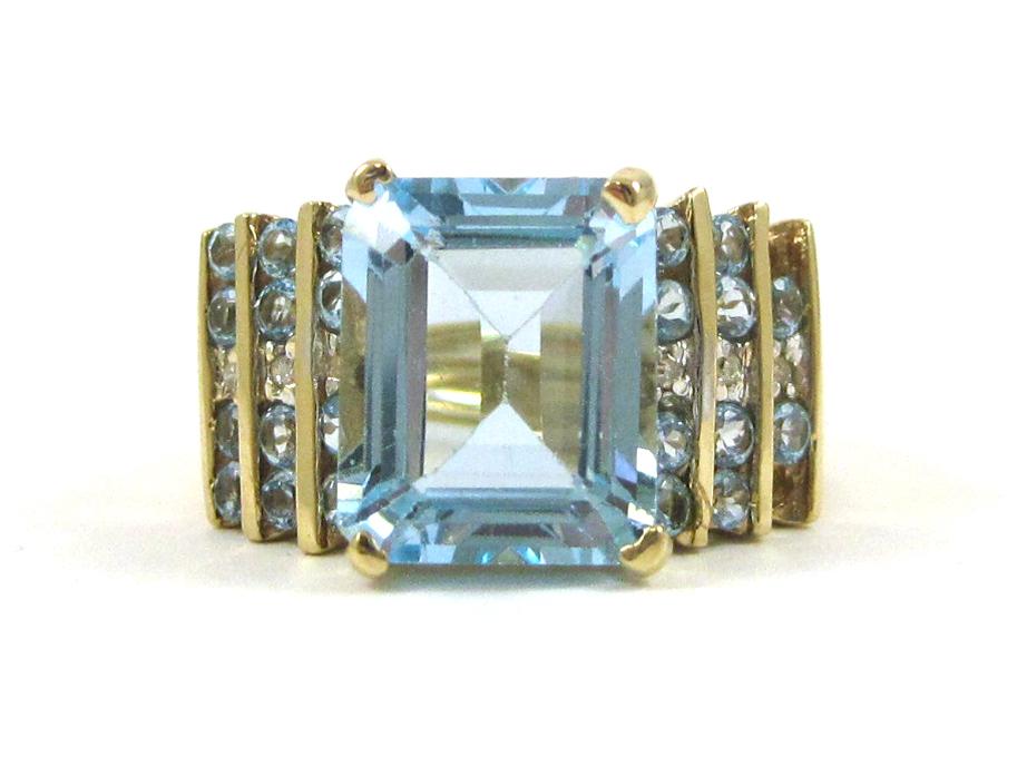 Appraisal: AQUAMARINE DIAMOND AND FOURTEEN KARAT GOLD RING with round-cut aquamarines