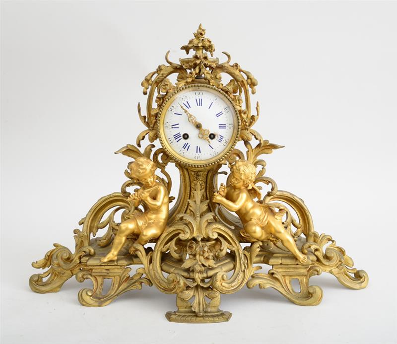 Appraisal: LOUIS XV STYLE GILT-BRONZE MANTLE CLOCK The in enamel dial