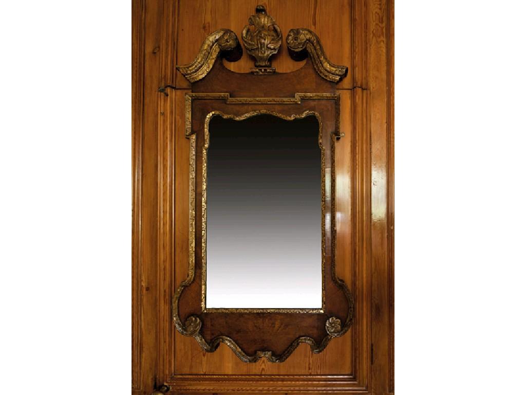 Appraisal: A GEORGE II WALNUT AND PARCEL-GILT MIRROR the bevelled rectangular