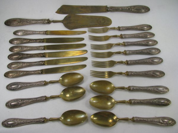 Appraisal: German Solingen twenty piece dessert set with silver hollow handles