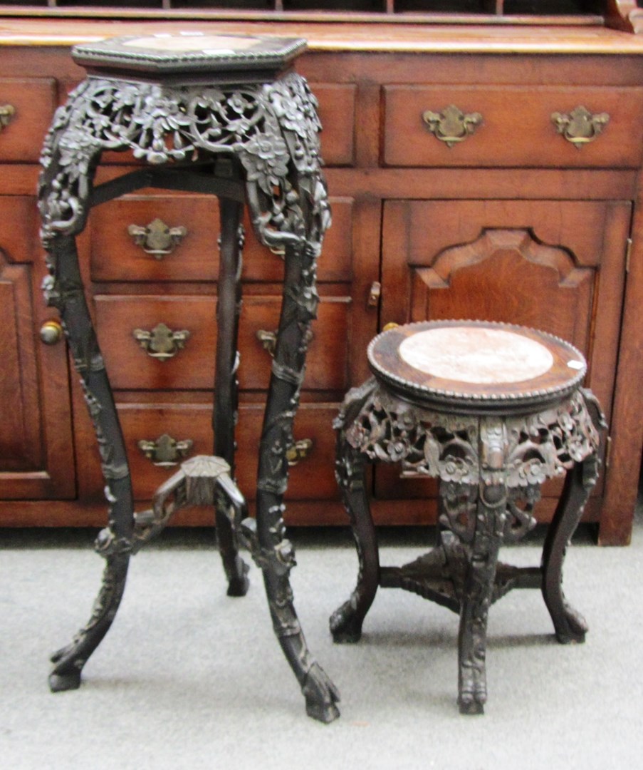 Appraisal: A late th century Chinese marble top carved hardwood urn