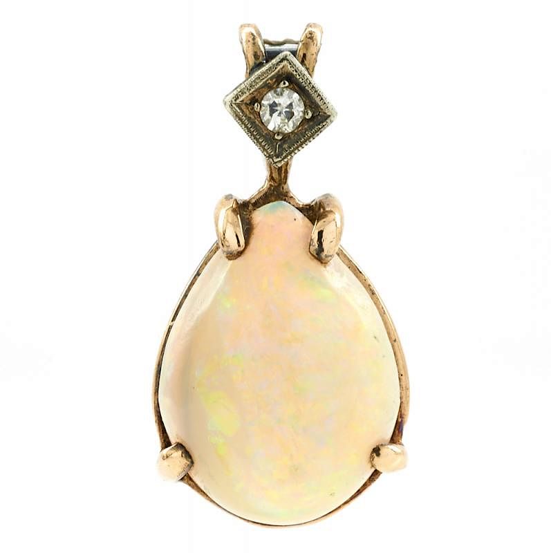 Appraisal: k Yellow gold opal and diamond pendant k Yellow gold