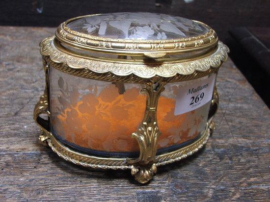 Appraisal: A CONTINENTAL GILT BRASS AND ENGRAVED GLASS CASKET with hinged