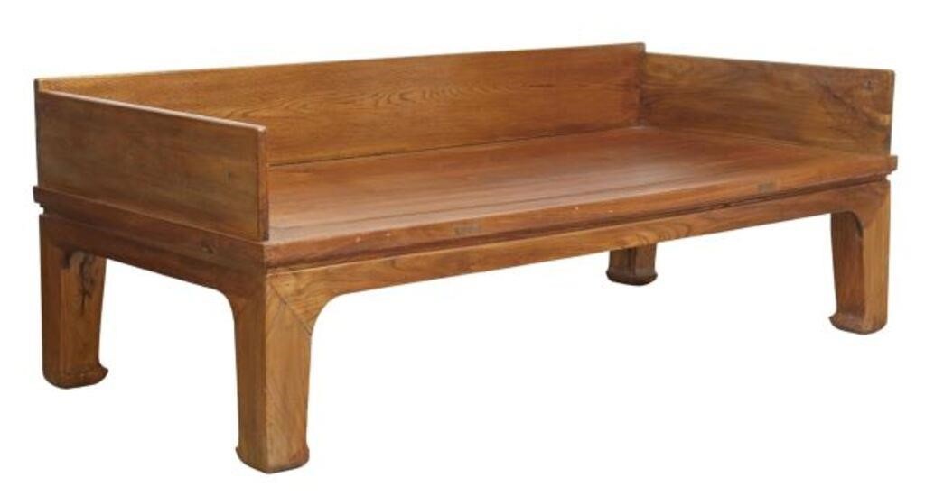 Appraisal: Chinese elmwood daybed having low back and side supports rising