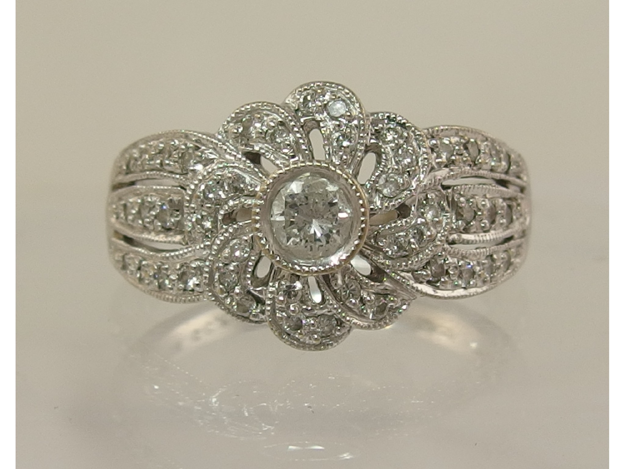 Appraisal: An ct white gold diamond set flower dress ring